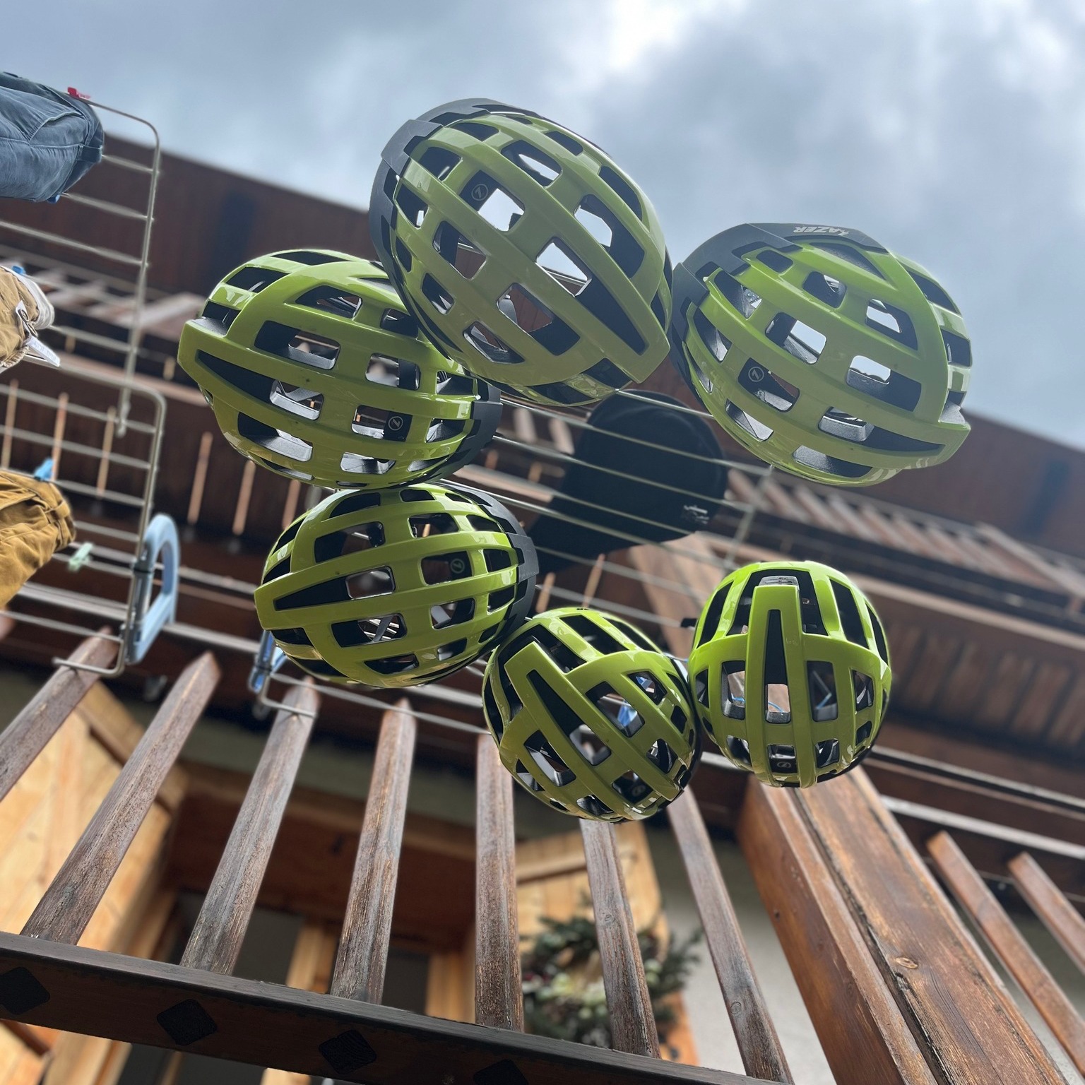 lots of cycling helmets hanging up